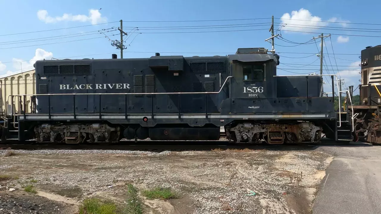Black River locomotive 1856 BDRV at crossing with side view and visible lettering
